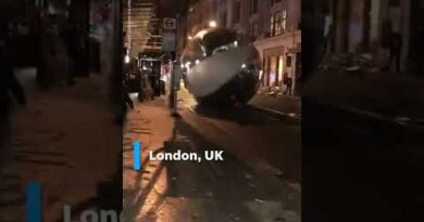 Giant Christmas ornaments tumble through windy London streets | USA TODAY #Shorts